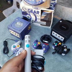 1 Of Choose console Nintendo GameCube black or Blue.. 3 Original controllers. 1 Game. 1 Mic. 1 Wheel racing. All cables $300! Or $400! Both consoles