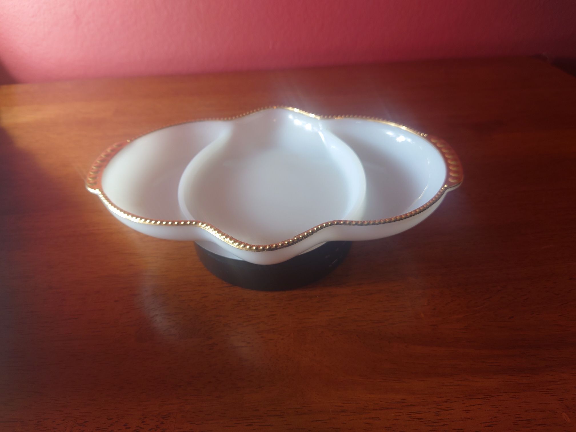 vintage Fire King white milk glass divided serving dish with a gold trim.
