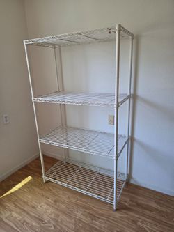 White metal shelf 5' tall x 3' wide x 18" deep $65