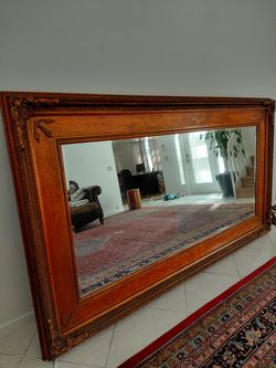 Large mirror in gold frame