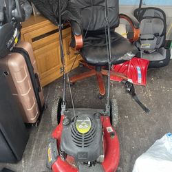 2 Lawn mowers red and black one