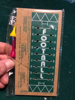 New in package. Football dice & peg game by Talent City