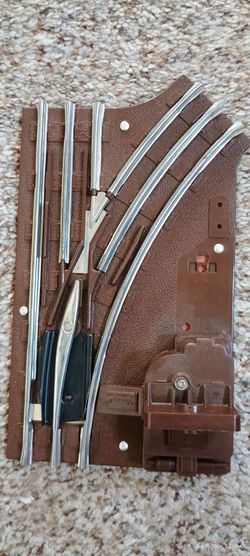 vintage Lionel Railroad Train O-27 Gauge Right-Hand Manual Track Switch (such as part #65022 or related 5122/6-65022 series), designed for 3-rail tubu