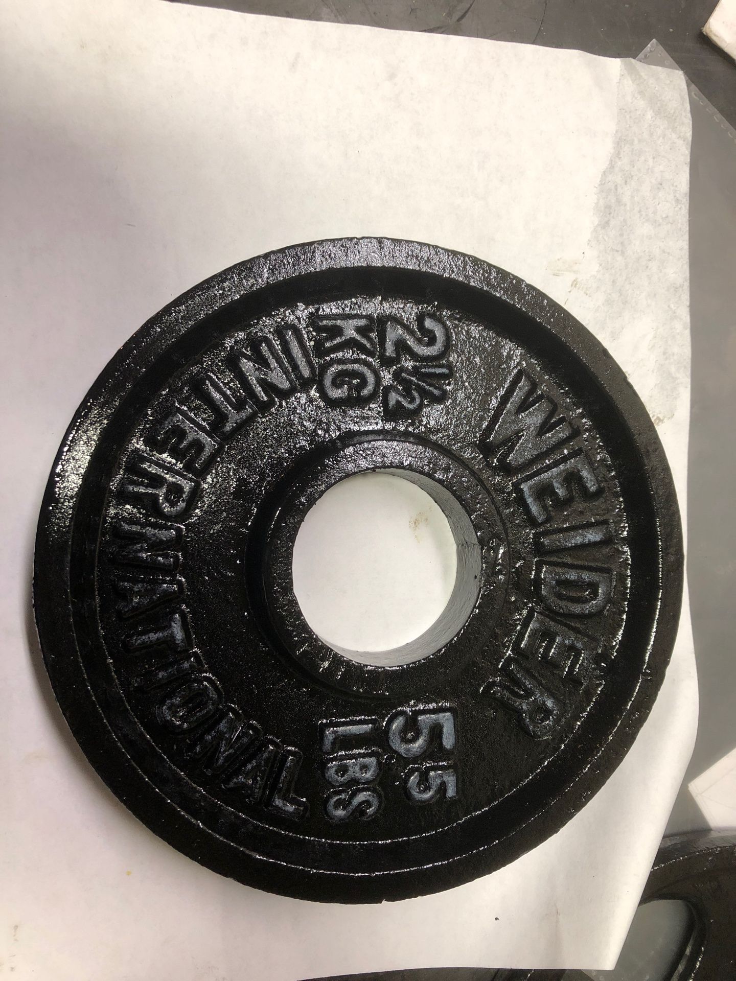 5.5lbs . Olympic size (1) weight plate.