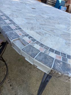 Outdoor table and swivel chairs