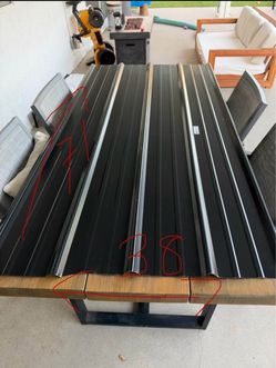Black metal roofing (2 of them) for $20  38x71in