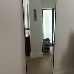 Black standing mirror