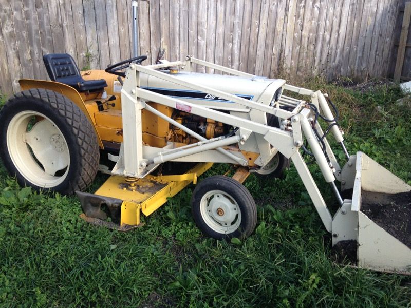 Cub cadet lowboy tractor with a front loader