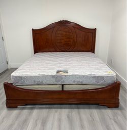 Beautiful Solid Wood King Size Bed with mattress and boxspring included. Delivery available for an additional cost.