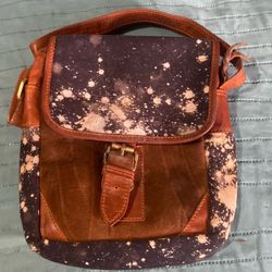 brown leather and blue patterned bag