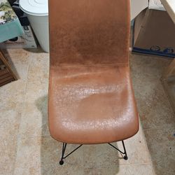 Brown faux leather chair