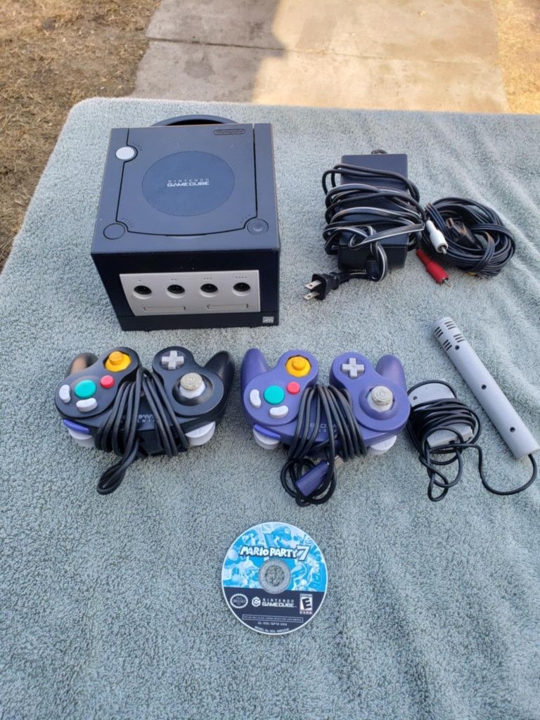 3 Controllers, 1 Mic Controller. 1 Game Mario Kart 7 . All cables, 1 Console GameCube & Power Racing Wheel Brand New In Box Tho $275 all combo