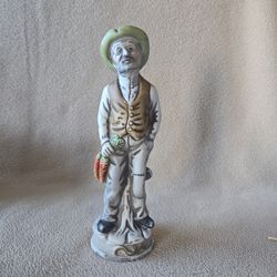 Old man leaning holding carrots