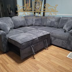 New Ariel Charcoal Sectional With Pull-Out Bed Financing Available 