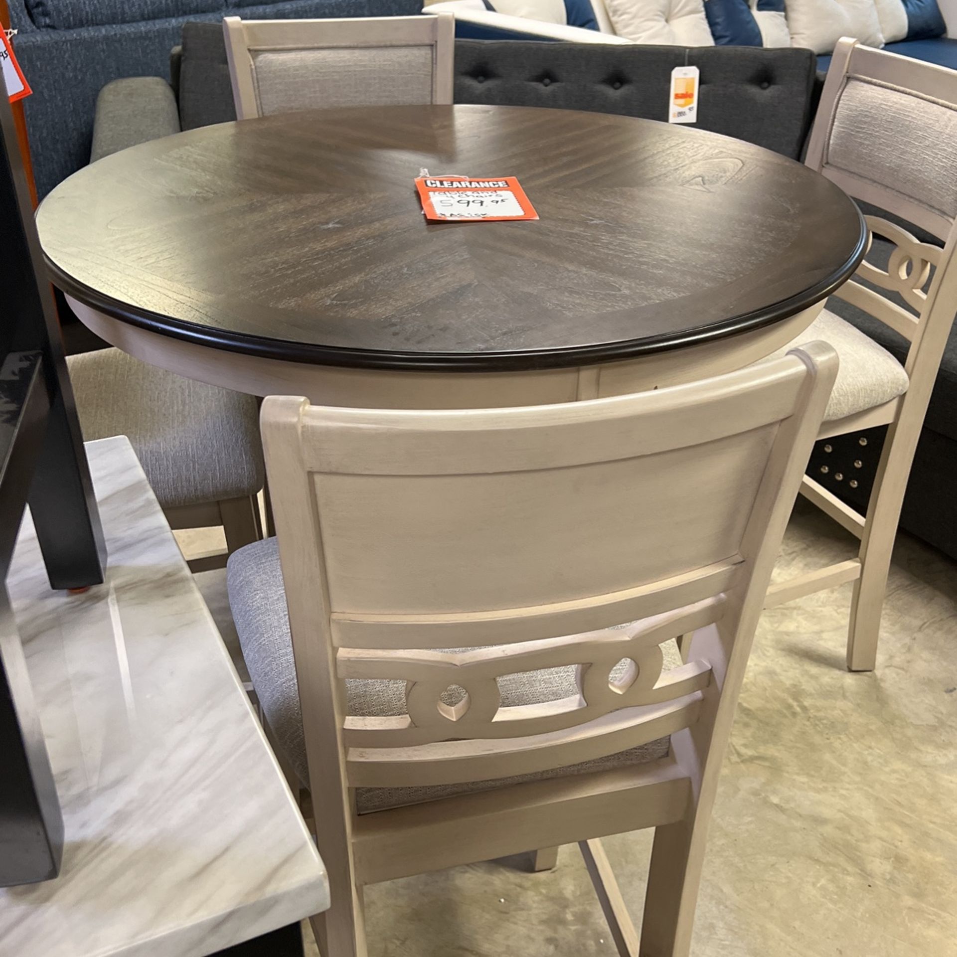 High table and four stools 36 inches high brand new $600