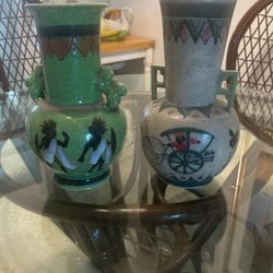 Antique pottery vases signed