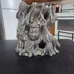 Large Buddha-themed tree trunk aquarium 