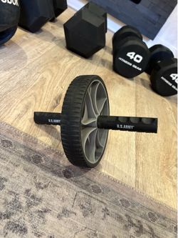 Ab roller and Rebook medicine ball with handles.
