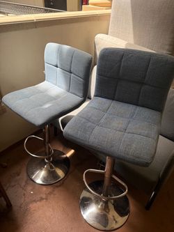 Set of two (2) adjustable bar stool style chairs