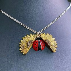 New sunflower ladybug locket necklace. Gold or silver available.  SHIPPING AVAILABLE 