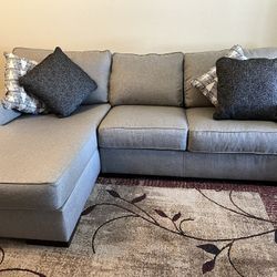 Sofa, 97” Long with Chaise-Gray.  Pillows Included.