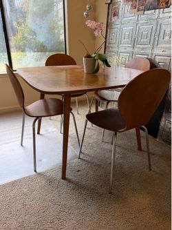 Mid-century modern dining room table with chairs
