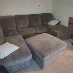 Grey Couch And Reversible Ottoman 