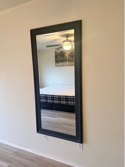 Large wood framed mirror