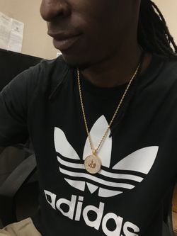 Iced out pendant with rope chain