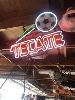 Original neon fixture with rolling soccer ball