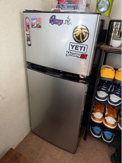 Insignia mini fridge with freezer.