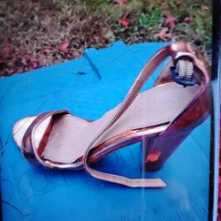 A Sexy pair Of Shiny Gold  Heels 