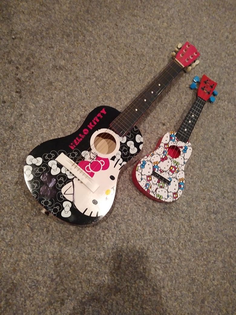 HELLO KITTY WOOD GUITAR. AN UKALAYLE. BOTH. 100 BUCKS