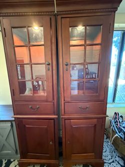 Two cherry wood cabinets.