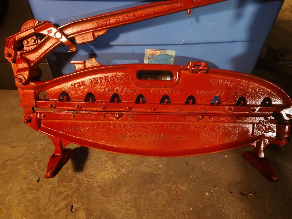 Old cast iron shingle cutter, made in Belleville IL.