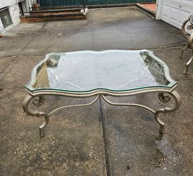 Large iron and glasstop coffee table