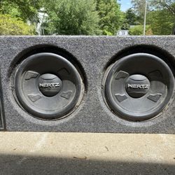 2- 10” Hertz Sub Speakers (600 watts each in Memphis Audio Dual 10" Ported Enclosure)
