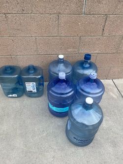 7 water containers: 5 five-gallon and 2 three-gallon