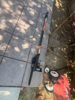 Electric chainsaw on a stick