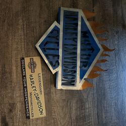 Two Harley Davidson Signs