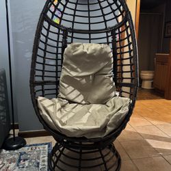 Pitner Dark Brown Swivel Faux Rattan Outdoor Patio Lounge Chair with Beige Cushion by Noble House