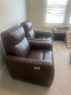 Two brown electric recliners