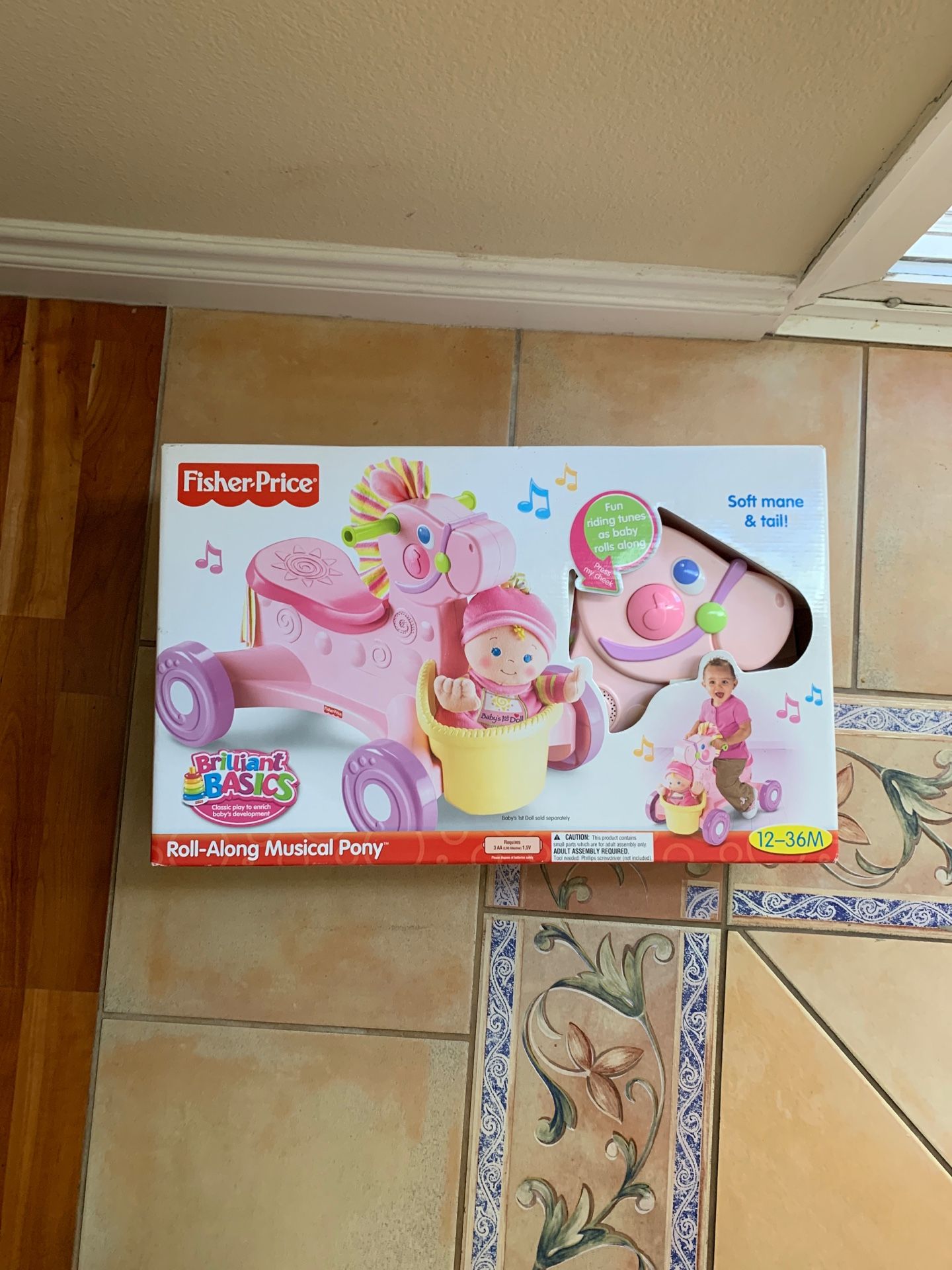 Fisher Price roll along musical pony