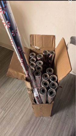 18 rolls of candy cane wrapping paper