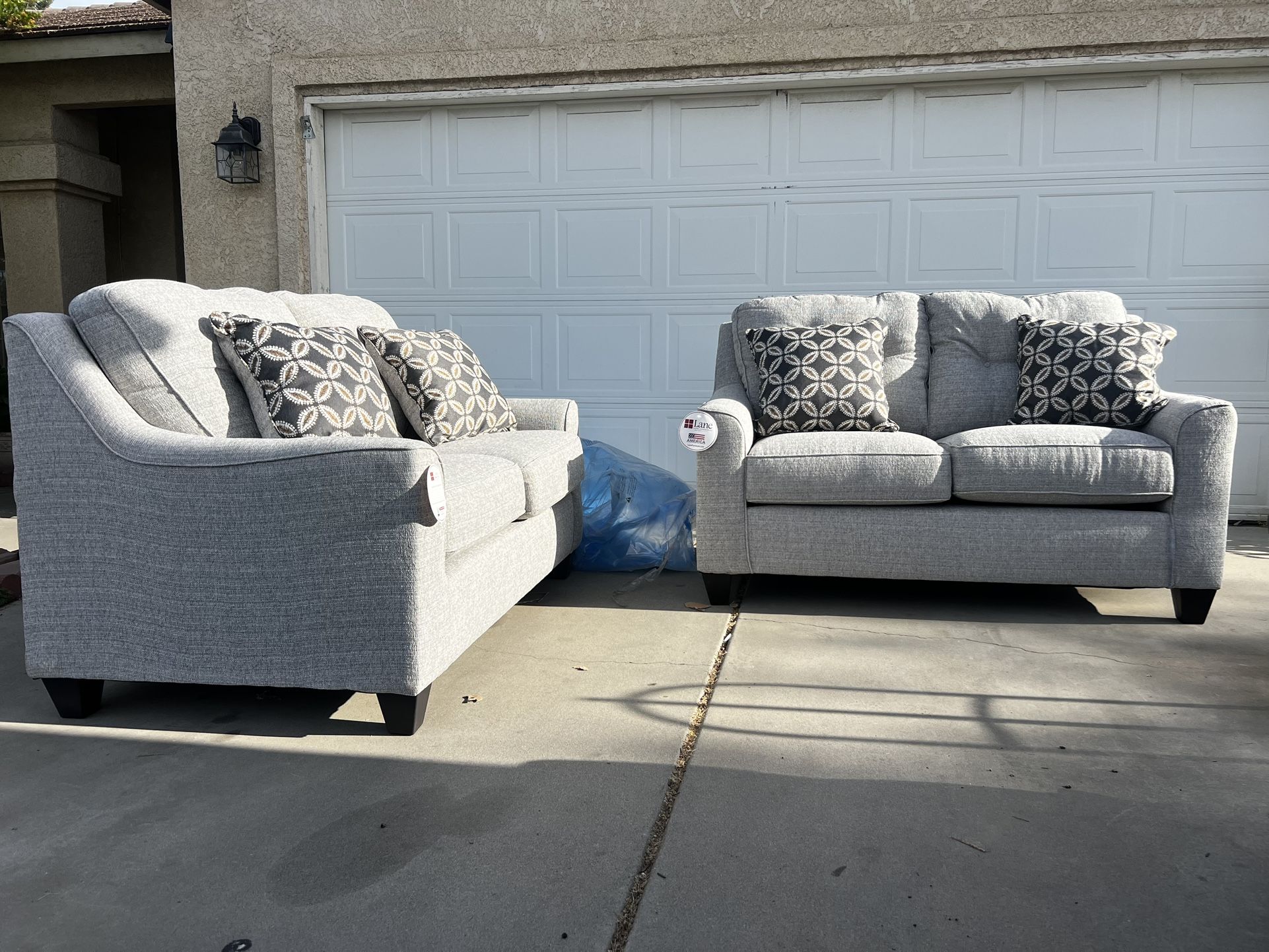 Brand New. (Set of 2) Lane Love Seat Sofa’s. Tweed color with accent pillows. $549