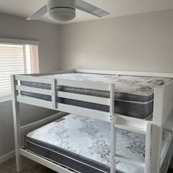 Full over Full bunk bed. Dark walnut,grey & white-$499. Full mattresses -$125.00 each. Assembly not included. Taxes included. Free delivery.  Se habla