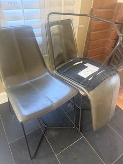 West Elm Leather Slope dining chairs