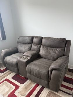 Gently Used Gray Power Reclining Loveseat with Console & Built-in Outlets
