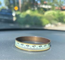 Vintage brass & enamel measuring tape bracelet