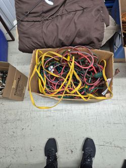 Box of extention cords $25 box of Tupperware $25
